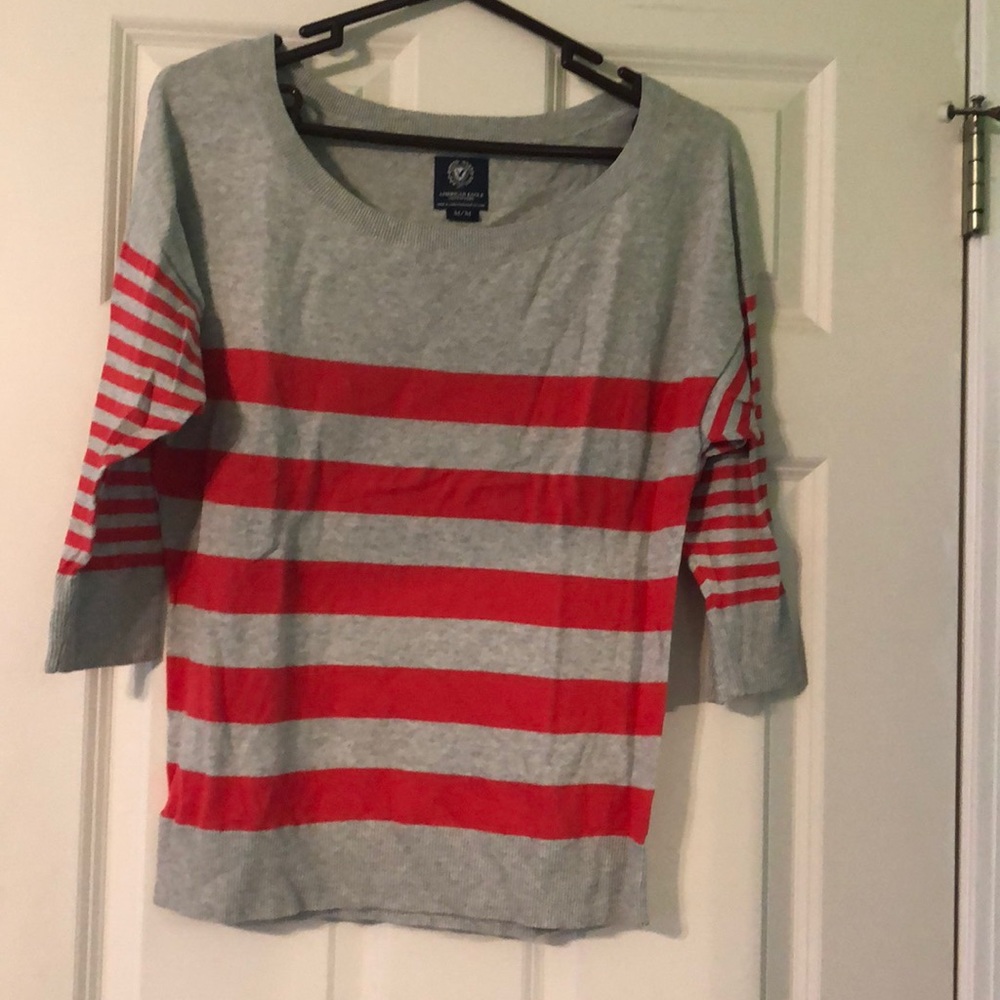 Striped red and gray American Eagle sweater.